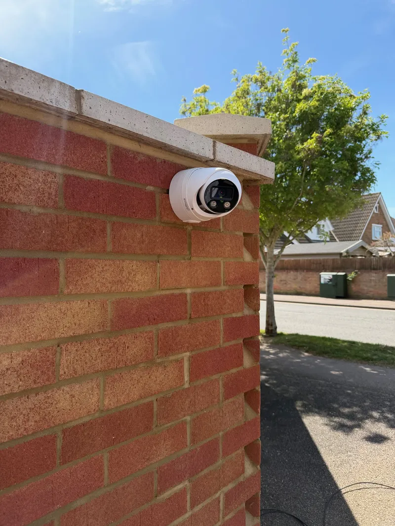 CCTV camera mounted on a garden wall covering a footpath, installed by MAC Secure