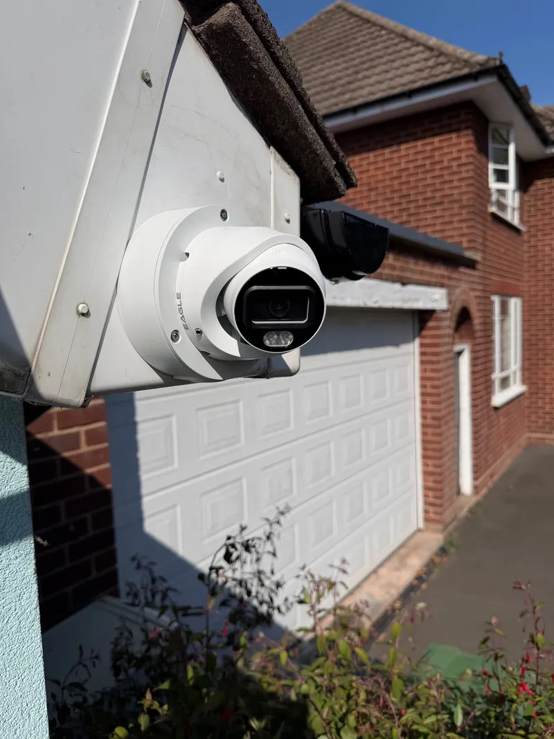 Turret CCTV camera covering a driveway and garage, installed by MAC Secure